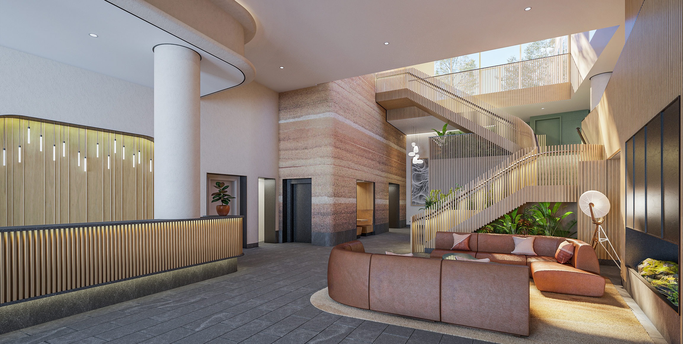 South Tower residential lobby image with seating arrangement and feature stair to the second floor amenities.